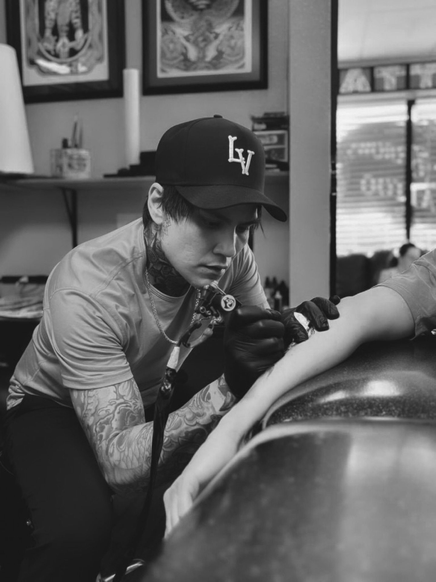 Ky, traditional tattoo artist, tattooing at Three Arrows Tattoo in Las Vegas, Nevada